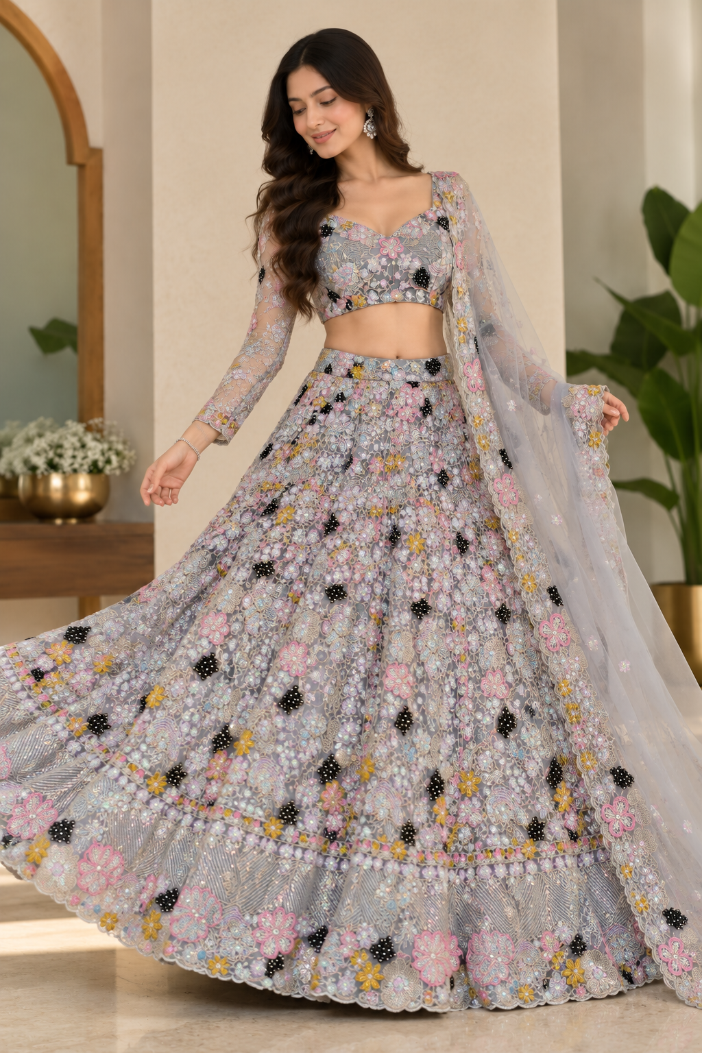 Dynamic full-length shot capturing the voluminous circular flare and scalloped floral hem border of a silver-grey embroidered lehenga skirt.