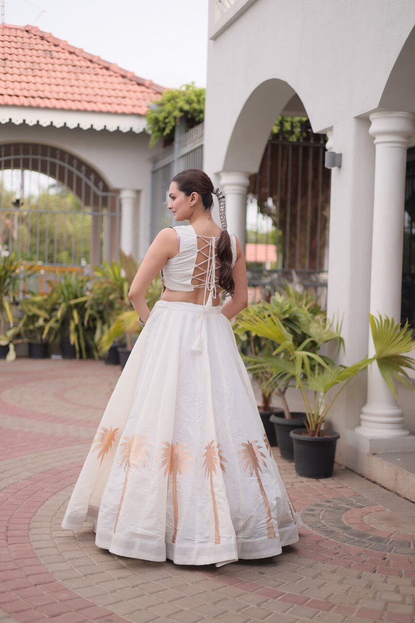 White Roman Lehenga Choli with Coconut Gota Work & Kutchi Gamthi Embroidered Blouse