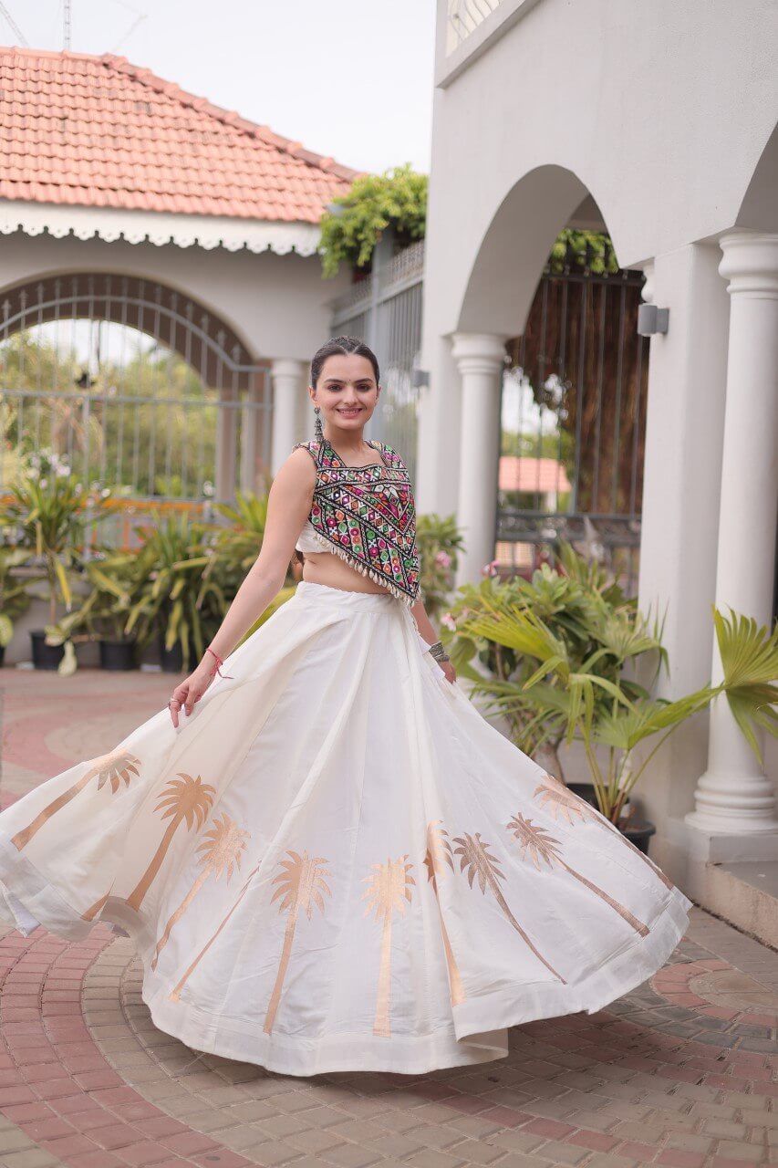 White Roman Lehenga Choli with Coconut Gota Work & Kutchi Gamthi Embroidered Blouse