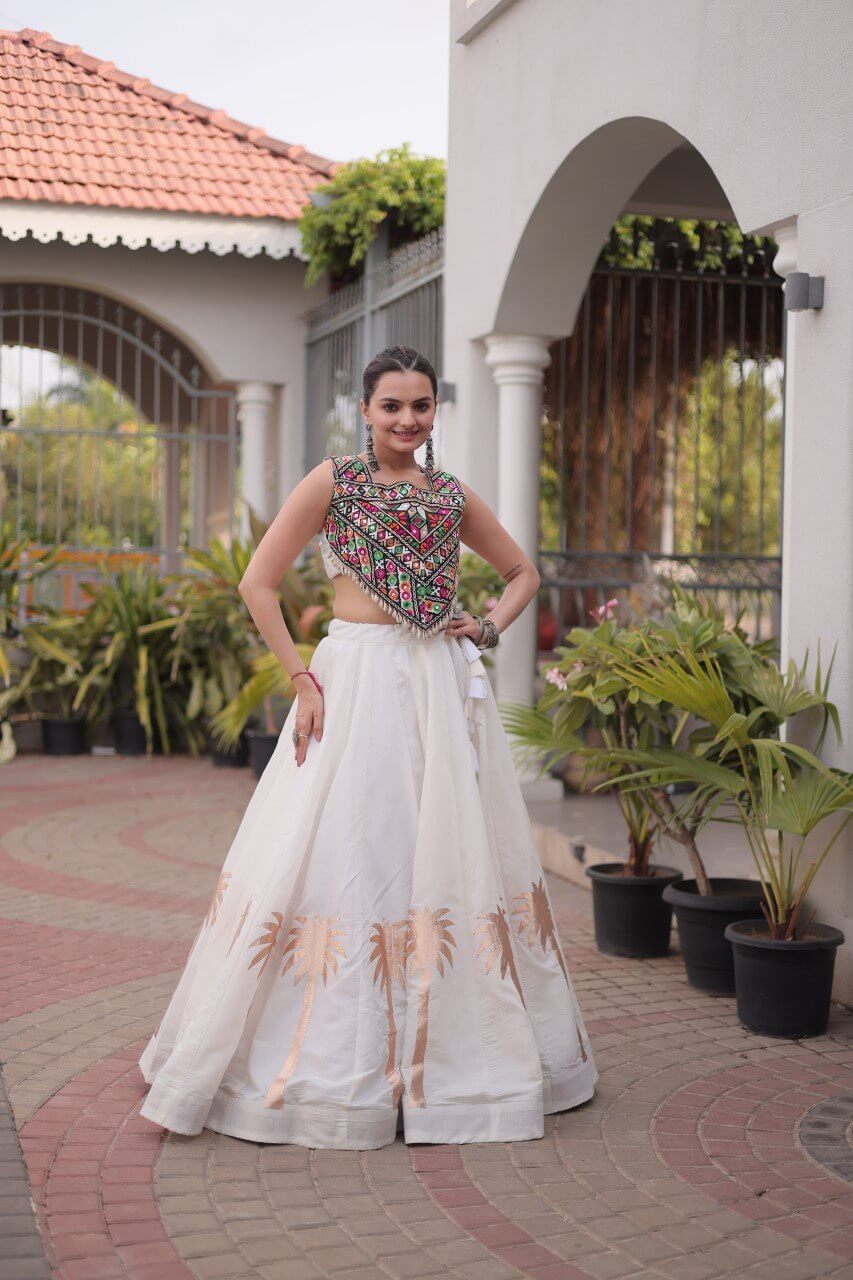 White Roman Lehenga Choli with Coconut Gota Work & Kutchi Gamthi Embroidered Blouse