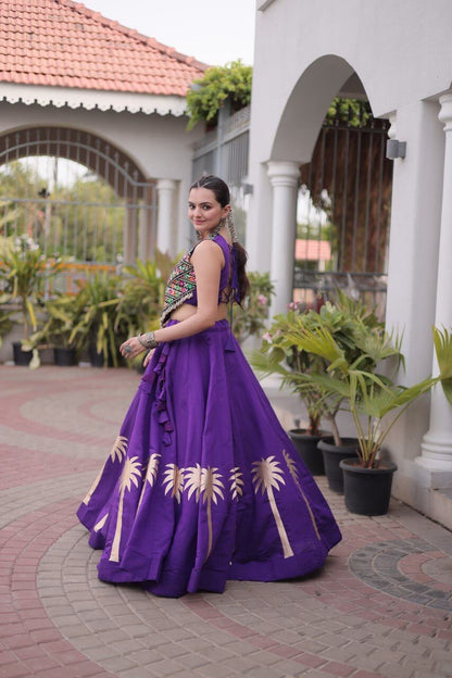 Purple Kutchi Gamthi embroidered lehenga choli with gold coconut gota work, side view showing flared skirt and ruffle detailing