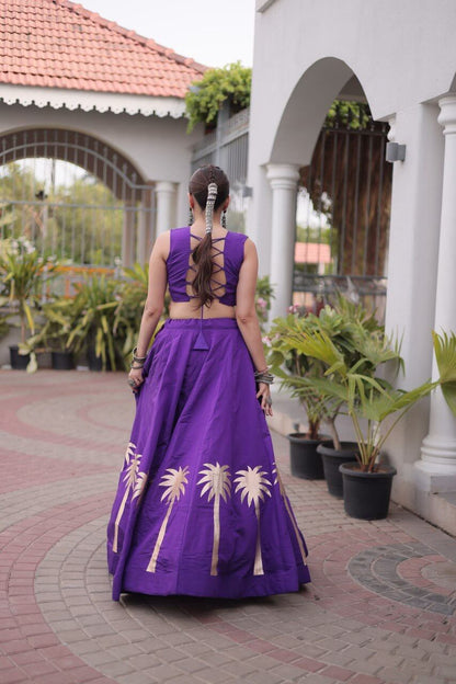 Purple sleeveless lehenga choli with lace-up back blouse and gold coconut gota detailing, back view