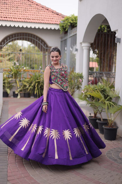 Purple flared lehenga with colorful geometric embroidered choli and gold palm tree motifs, full front view