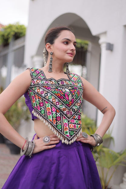 Close-up of purple lehenga choli featuring colorful Kutchi Gamthi embroidery, square neckline and Codi lace detailing on the blouse