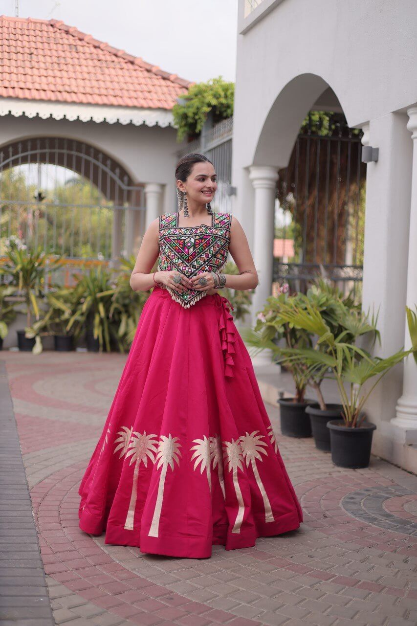 Magenta pink lehenga choli with colorful Kutchi Gamthi embroidered blouse and gold Coconut Gota work