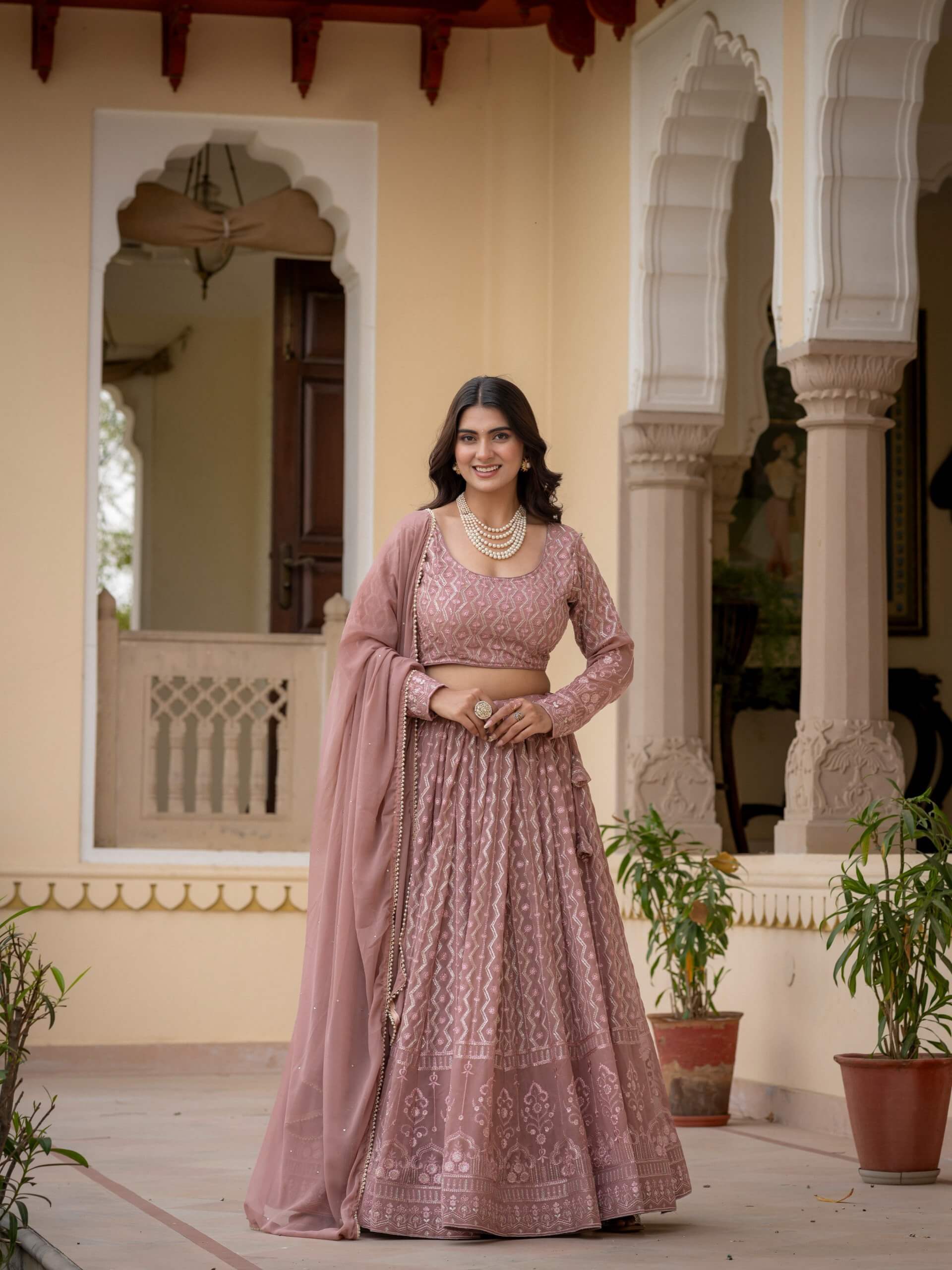 Rosy brown Indian lehenga choli with embroidered blouse and draped faux georgette dupatta
