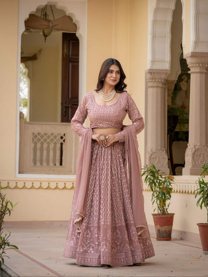 Rosy brown lehenga choli featuring long sleeve embroidered blouse and matching dupatta