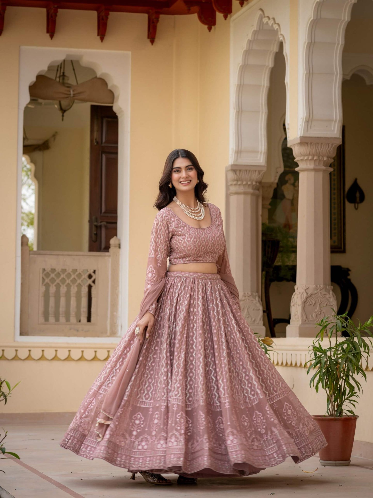 Rosy brown embroidered lehenga with geometric motifs and detailed decorative border