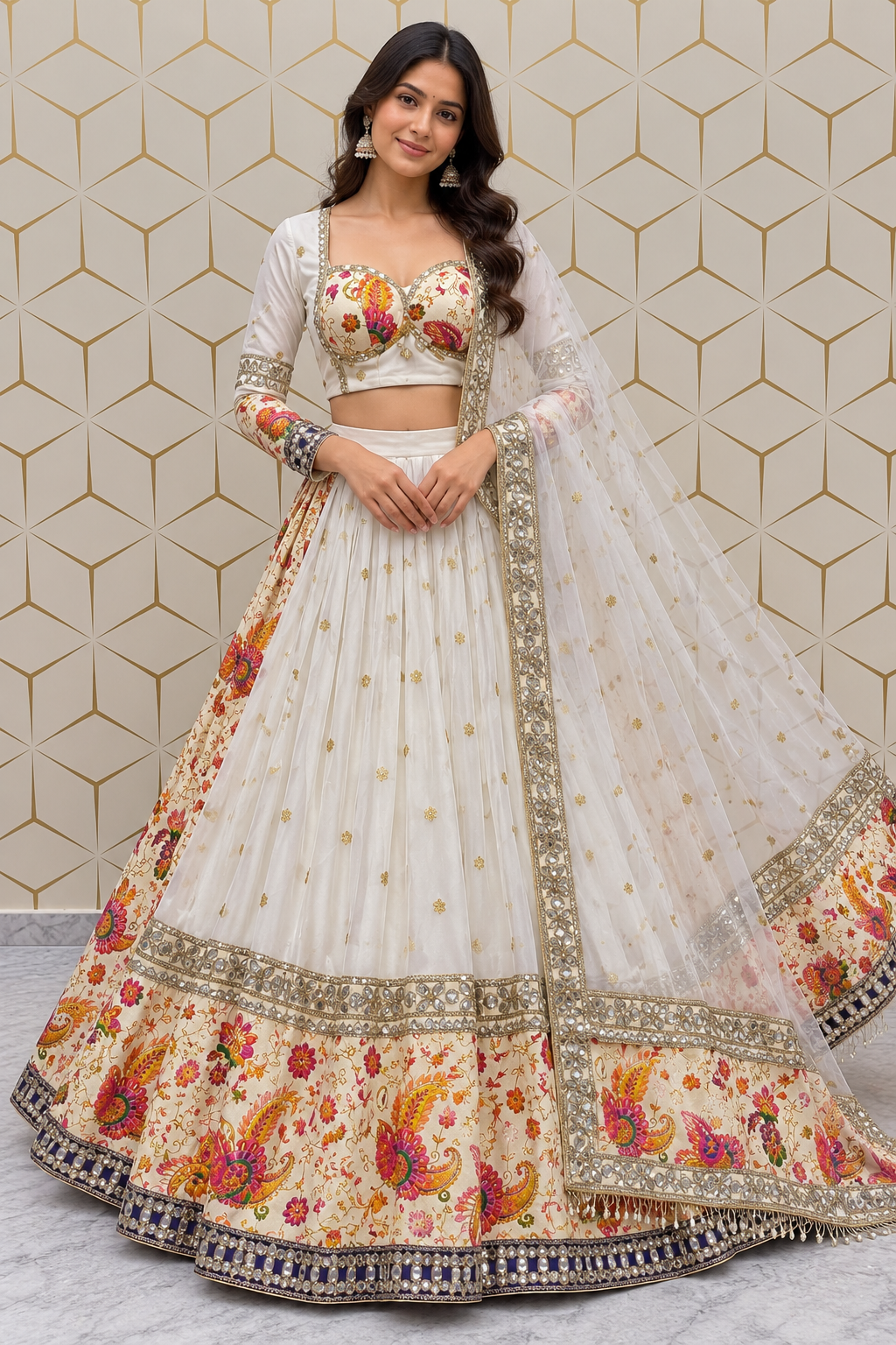 Standing full-length front view of a model in an ivory pleated lehenga skirt featuring floral buttis, a colorful Paithani-style border, and an embroidered bustier choli.