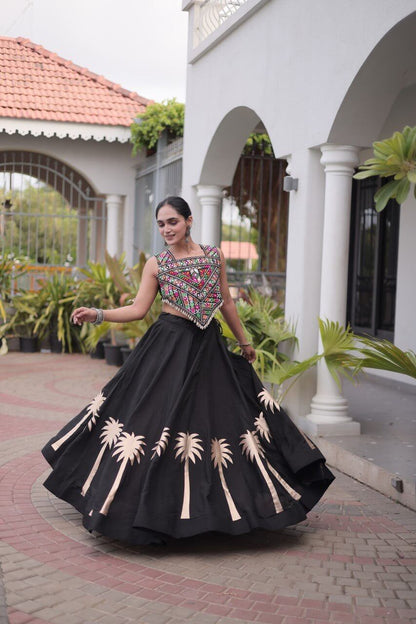 Black lehenga choli with multicolor patterned blouse and beige floral motifs shown during a twirl