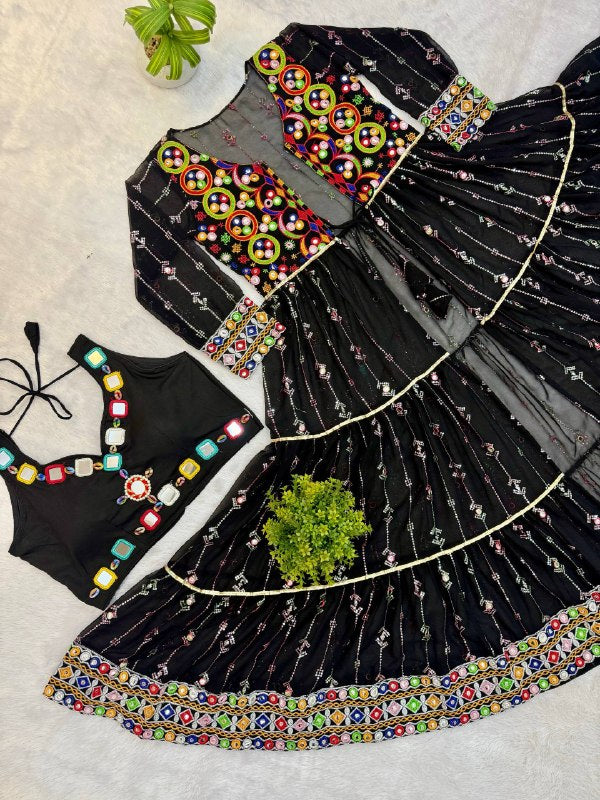 Flat lay shot of black sleeveless crop top and front-open sheer tiered shrug with colorful thread and mirror embroidery