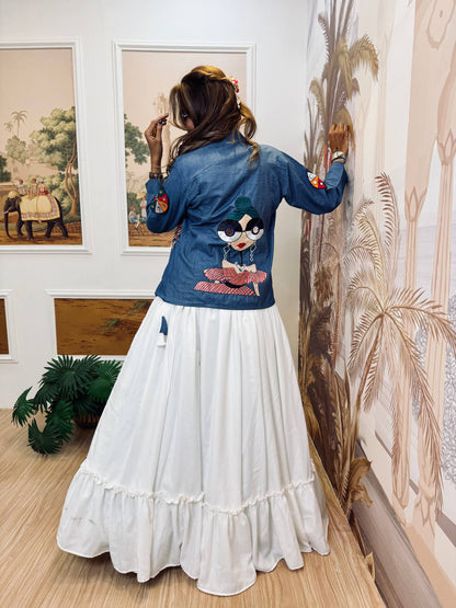 Close back view highlighting the multi-color glasses girl graphic embroidery patch on the blue jacket
