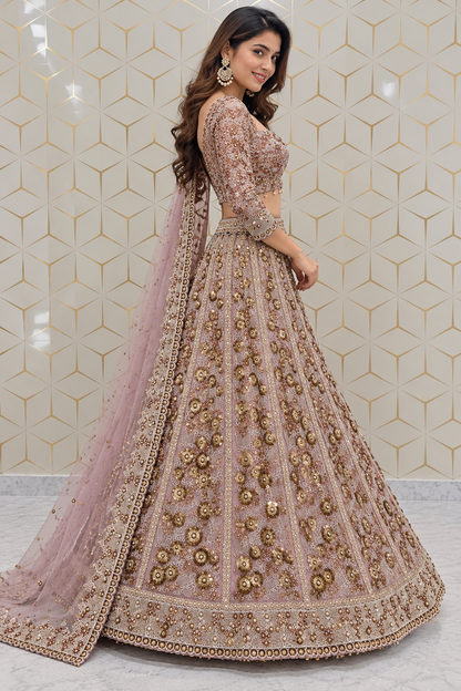 Side profile full-length view of a model wearing a dusty mauve bridal lehenga skirt adorned with 3D gold floral sequin kalis and three-quarter sleeve blouse.