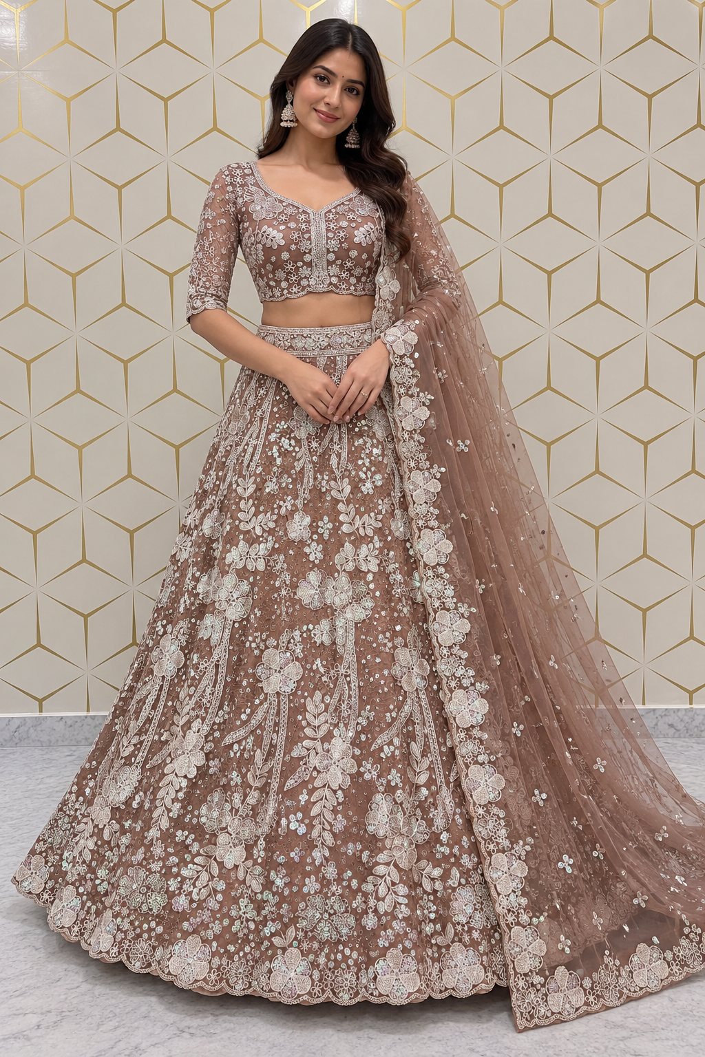 Standing full-length front view of a model wearing a heavily embellished dusty mauve and silver threadwork lehenga choli set.