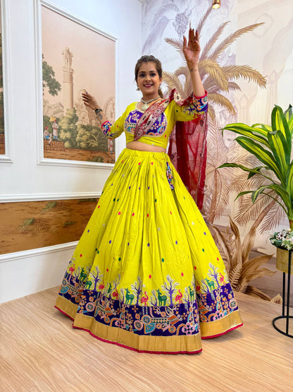 Close-up portrait of model wearing a lime-yellow blouse with a blue printed yoke patch, paired with oxidized jewellery and maroon dupatta