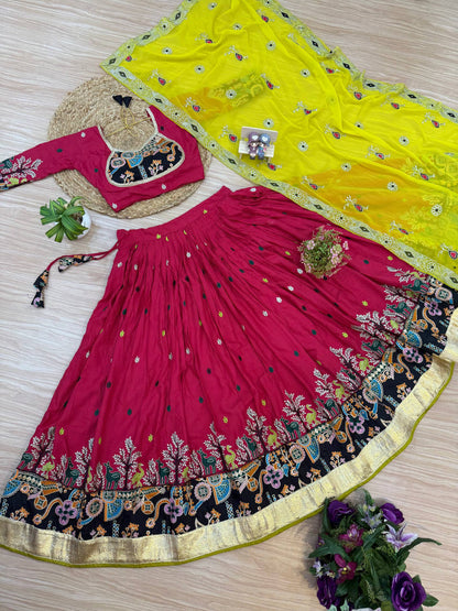 Flat lay view of magenta pink flared lehenga with animal-tree printed border, black-patch embroidered blouse, and bright yellow dupatta