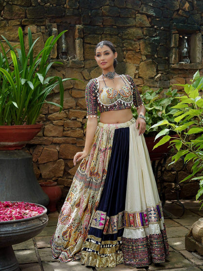 Full-length front view of off-white and navy blue kali lehenga with printed paisley panel and embroidered bustier blouse