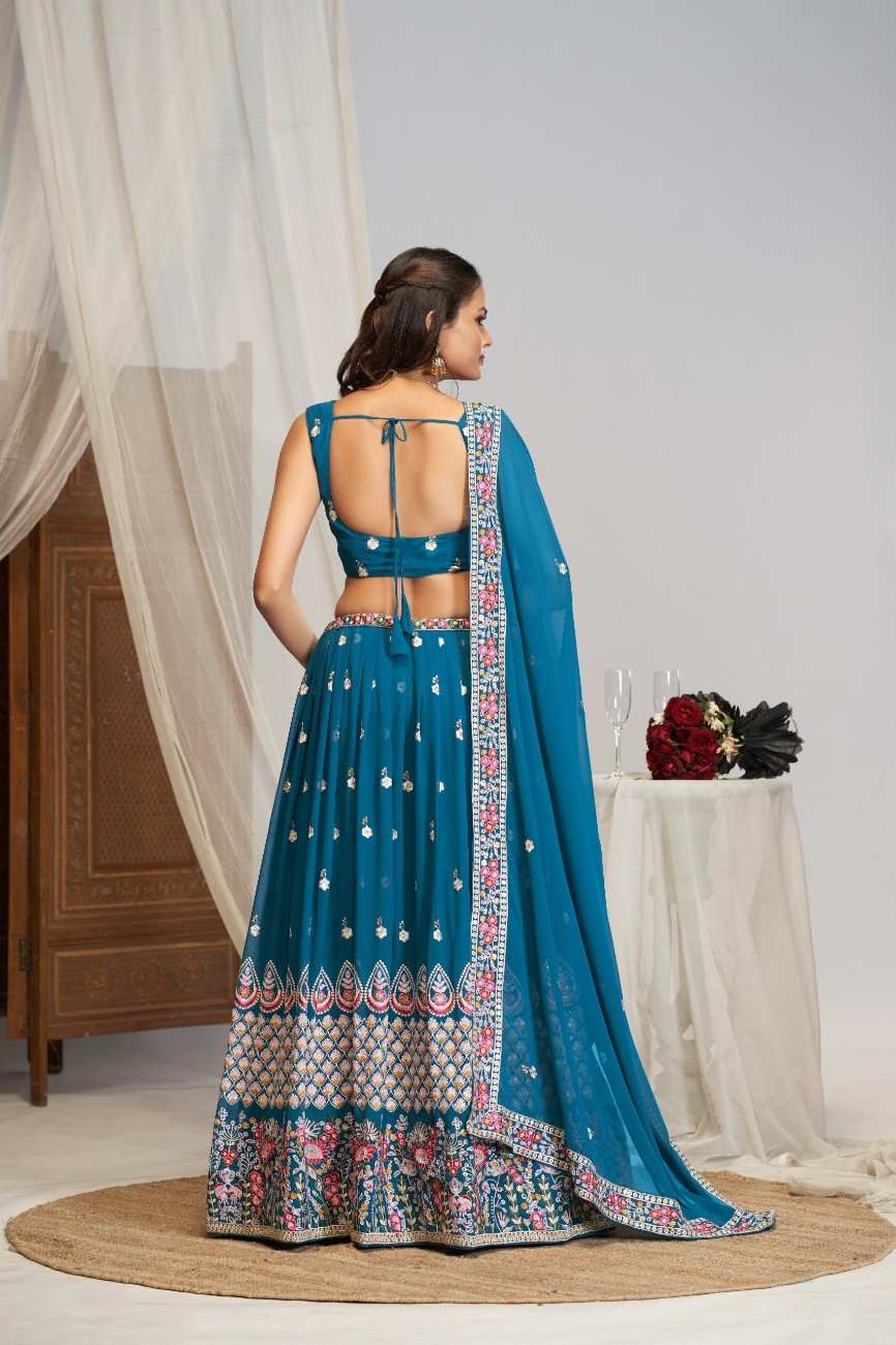 Back view of model in peacock blue lehenga choli showing tie-up blouse back design and border drape