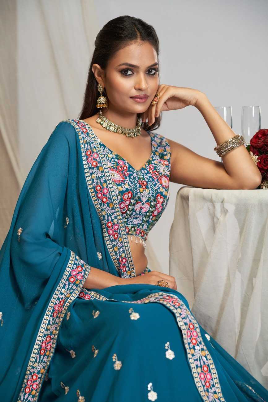 Close-up of peacock blue sleeveless blouse with multicolor floral embroidery and matching dupatta