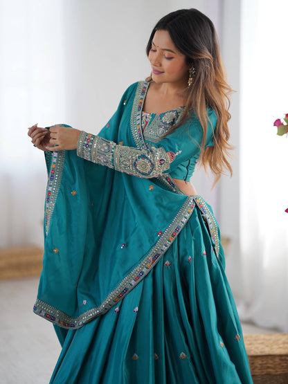 Side view of peacock blue full-sleeve embroidered blouse with matching dupatta draped over the shoulder