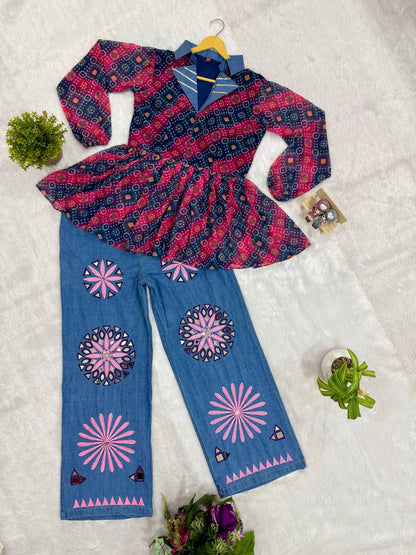 Flat lay view of pink and blue bandhani printed peplum top with denim lapel collar and mirror-embroidered wide-leg jeans