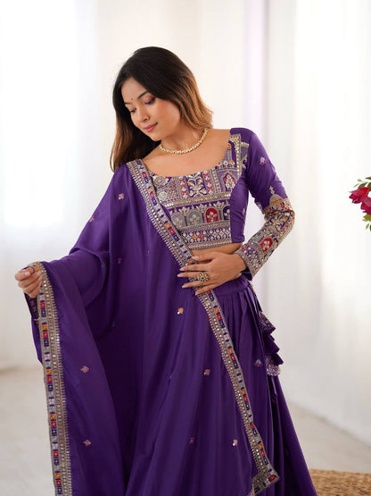 Close-up view of purple full-sleeve blouse with multi-color traditional embroidery and bordered dupatta drape