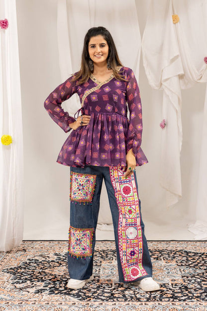 Full-length front view of model posing in purple printed angrakha peplum top and embroidered denim trousers