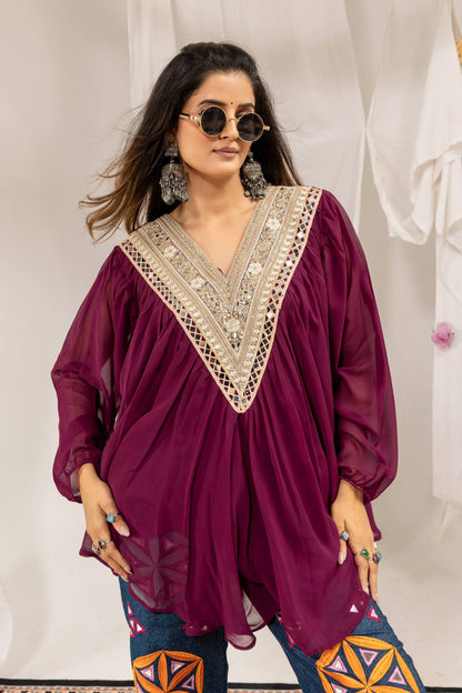 Close-up front view showing detailed neckline embroidery on purple full-sleeve pleated top