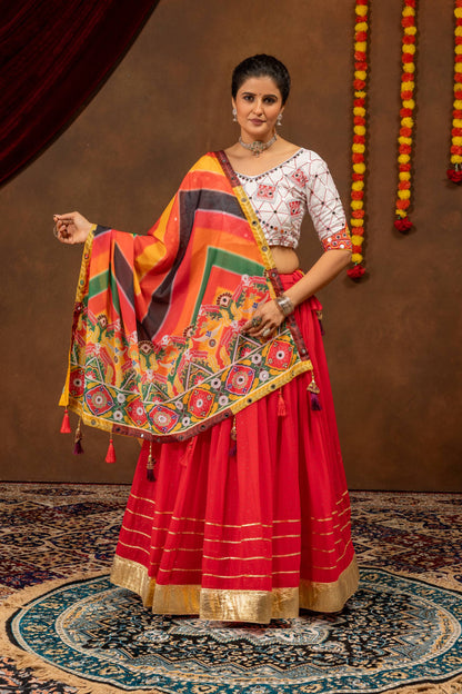 Full front view of a model wearing a red lehenga with gold border stripes, paired with an open multicolor printed dupatta.