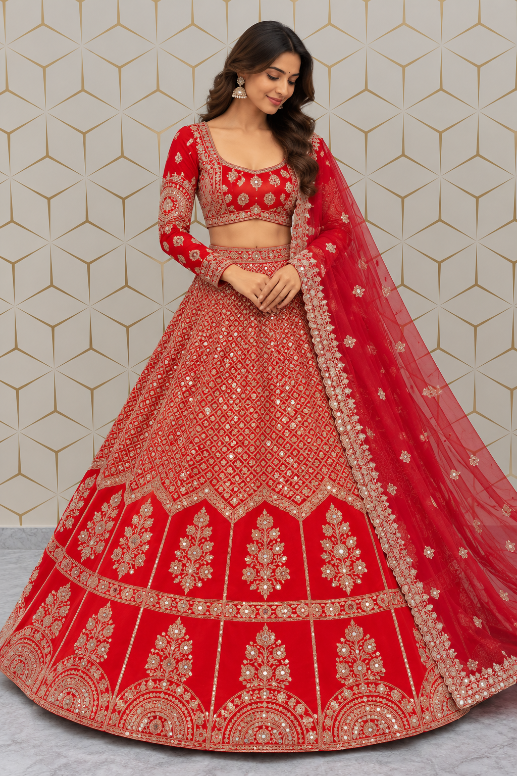 Standing full-length front view of a model wearing a crimson red bridal lehenga adorned with gold zari lattice jaal, floral bootas, and full-sleeve choli.