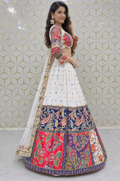 Side profile full-length view showing the flared circular silhouette of a white printed lehenga paired with a matching printed sheer dupatta drape.