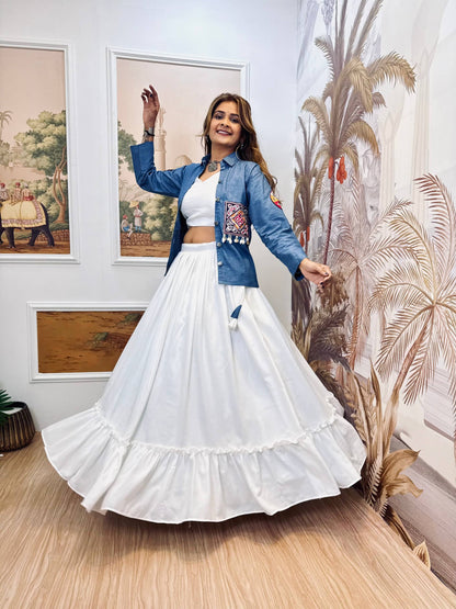 Full-length twirling shot displaying the wide bottom ruffle flare of the white lehenga paired with a blue jacket