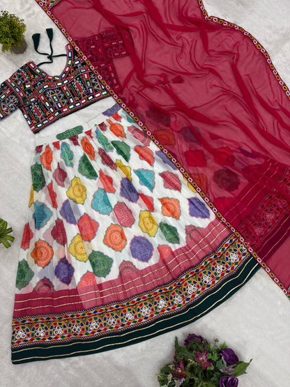 Flat lay view of white multicolor patola print lehenga skirt, embroidered green blouse, and pink dupatta