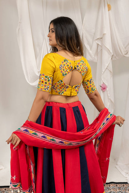Back view of model wearing yellow short-sleeve blouse with keyhole cut-out back detail and red dupatta